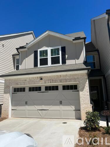A two-car garage is attached to a house.