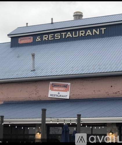 A sign on a building that says Shoreline Brewery & Restaurant.