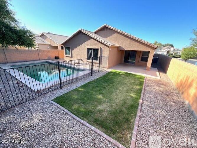 A house with a pool in the backyard.