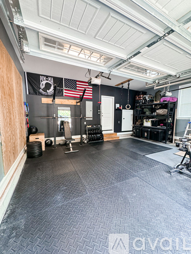 A gym with a black floor and a white ceiling.