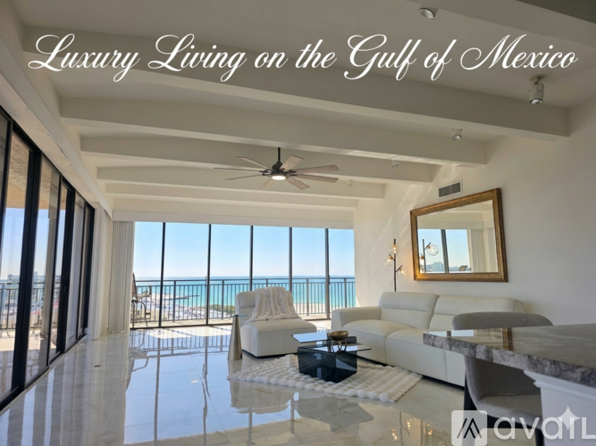 A living room with a view of the Gulf of Mexico.
