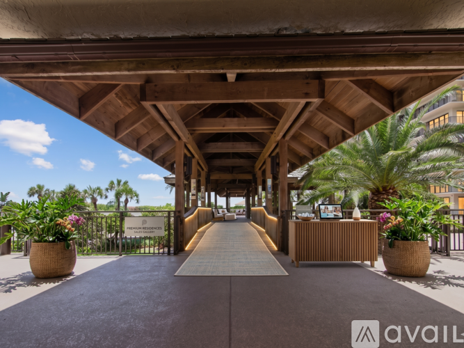 A wooden covered walkway with a sign that says "AVAILABLE" on the right side.