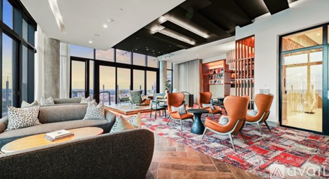 A living room with a grey couch and a wooden coffee table.