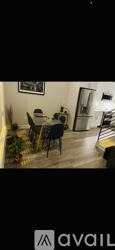 A dining area with a table set for four.