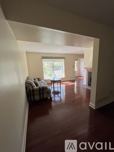 A living room with a couch and a table.