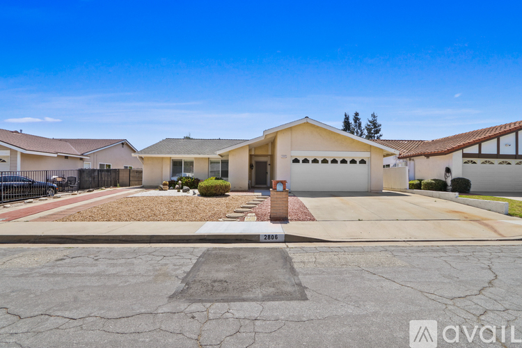 A house with a driveway in front of it is for sale.