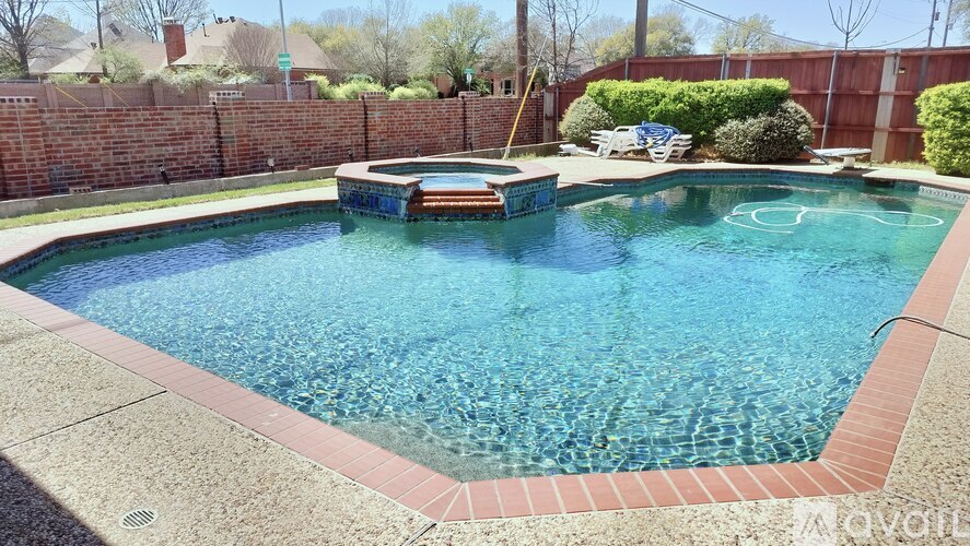 A small pool with a bench in the middle of it.