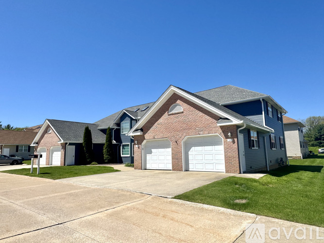 A house with a garage is for sale.