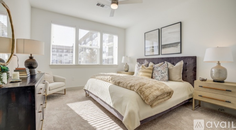 A bedroom with a large bed and a television.