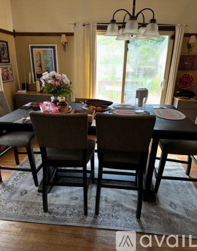 A dining room with a table set for two.