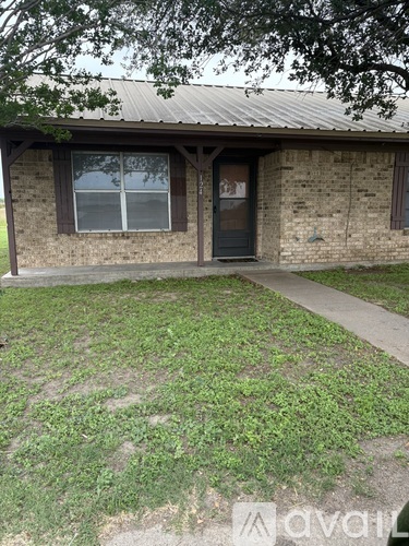 A house with a black door and window.