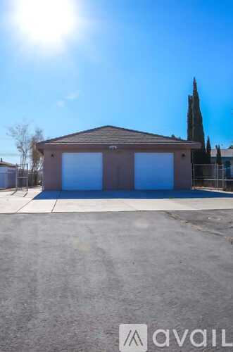 A building with a brown roof and blue windows is available for rent.
