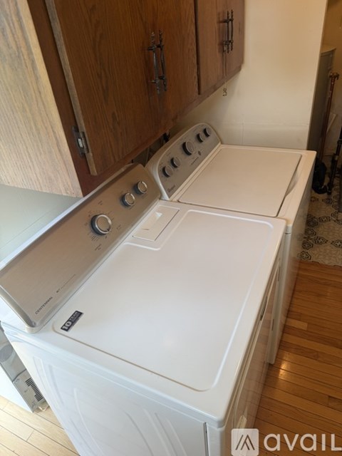 A white dishwasher and oven in a kitchen.