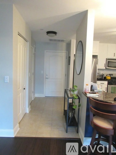 A kitchen with a table and chairs in the middle of the room.