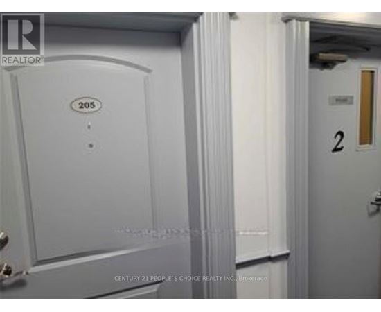 A white door with the number 205 on it.