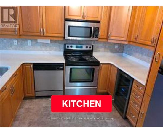 A kitchen with wooden cabinets and a stove top oven.