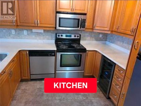 A kitchen with wooden cabinets and a stove top oven.