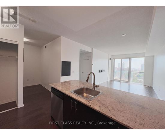 A kitchen with a sink and a dishwasher.