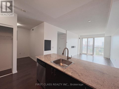 A kitchen with a sink and a dishwasher.