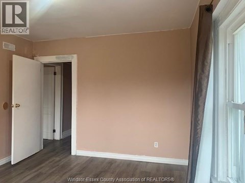 A room with a doorway leading to another room.