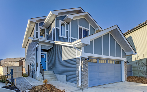 A modern house with a blue garage door.