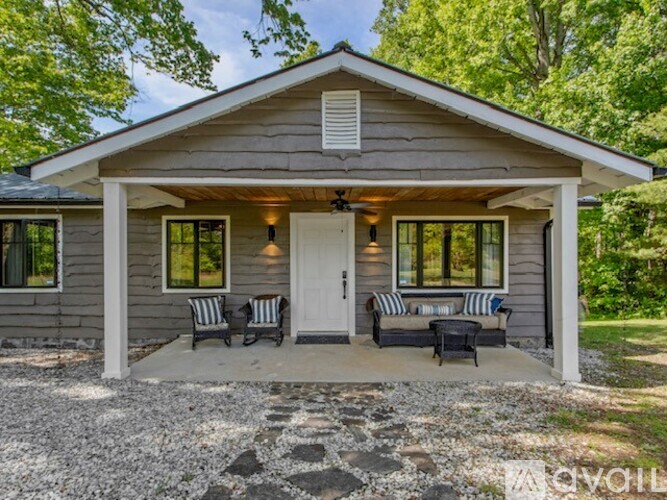 A house with a porch and a covered entrance.