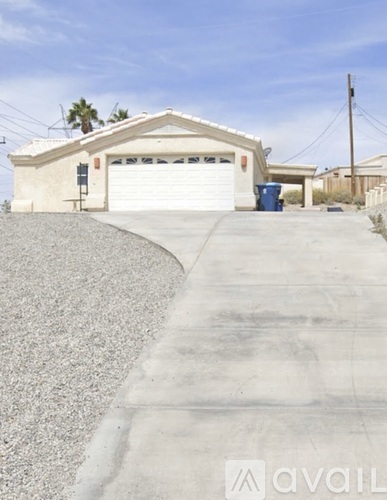 A house with a driveway and a garage door.