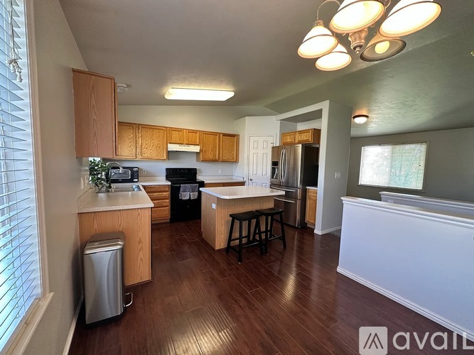 A kitchen with wooden cabinets and a white countertop.