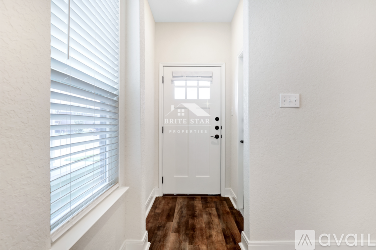 A white door with a glass window above it.