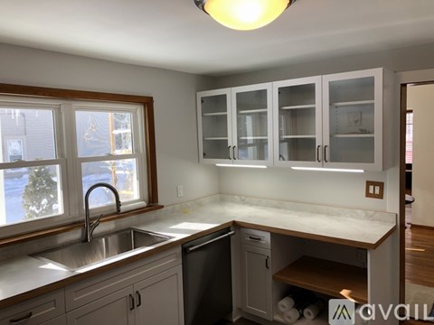 A kitchen with a window and a sink.