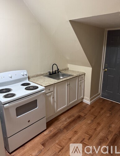 A kitchen with a stove top oven and a counter top.