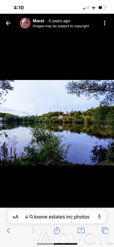 A serene landscape with a body of water and greenery.