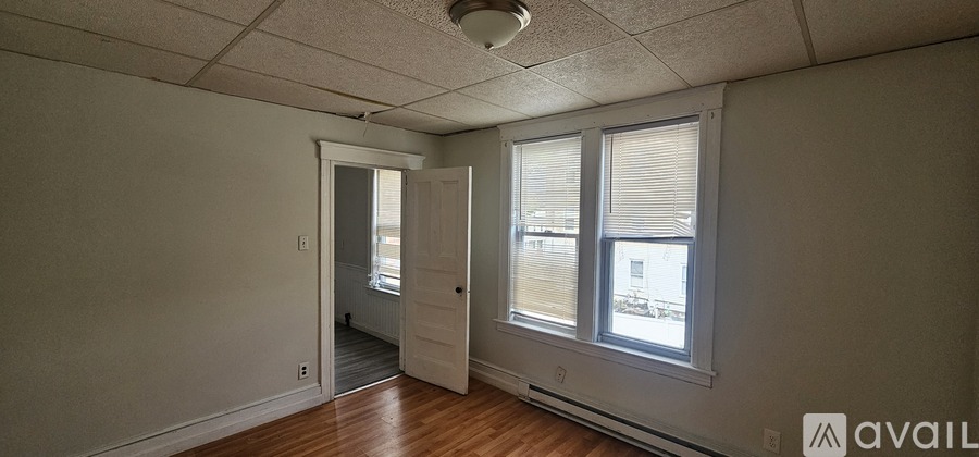 A room with a door and a window.