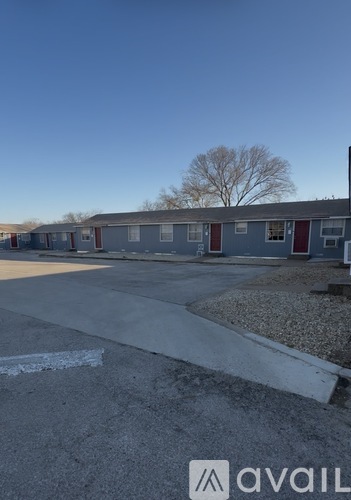 A parking lot with a building in the background.