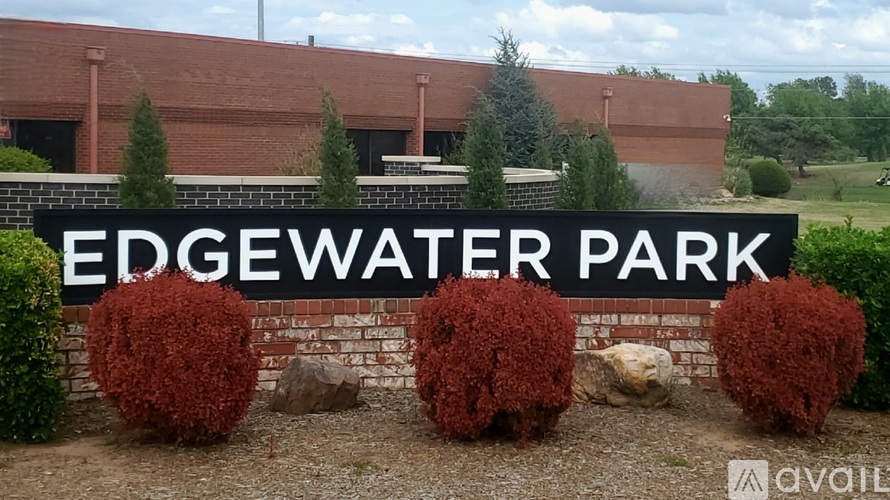 A sign that says Edgewater Park in front of a building.