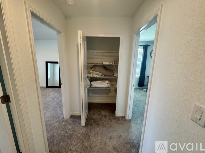 A bedroom with a bed and a closet.