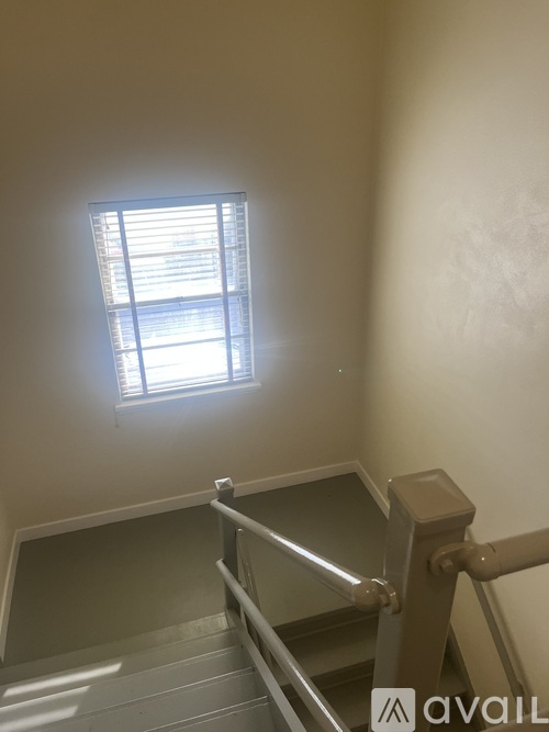 A room with a window and a door.