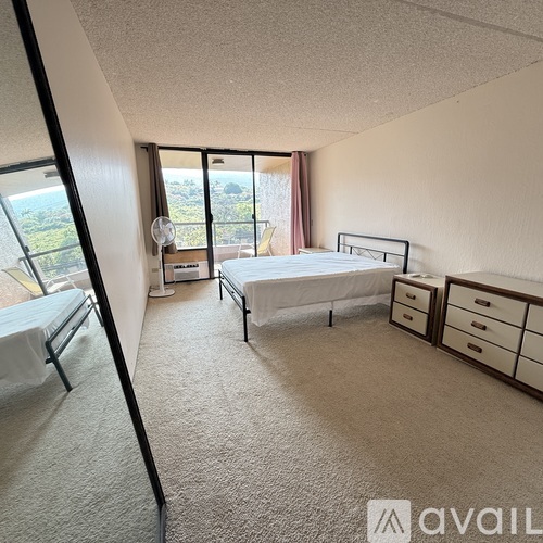 A bedroom with a bed, dresser, and chair is available for rent.