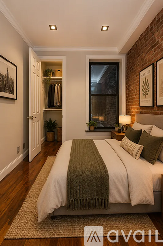 A bedroom with a large bed and a window.