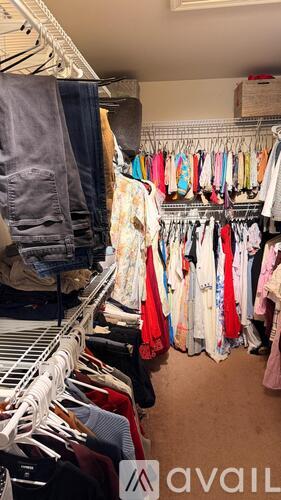 A clothing store with clothes hanging on racks.