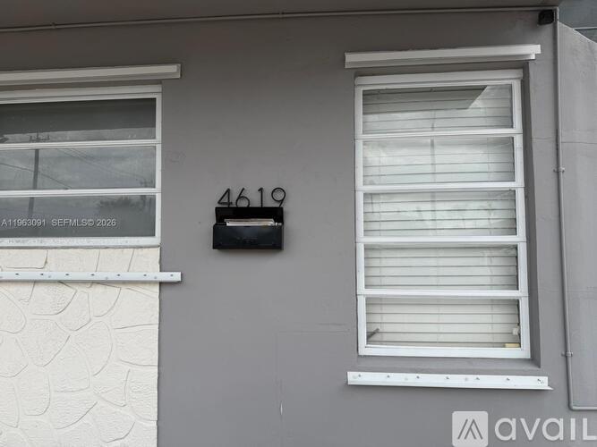 A house number 4619 is written on the wall.
