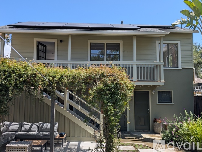 A house with a balcony and a patio area.