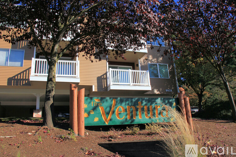 A brown building with a sign that says "The Ventura".