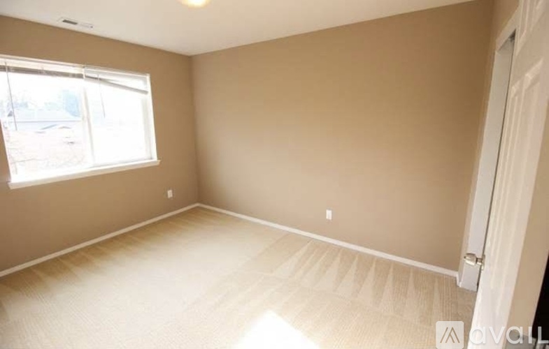 A room with a window and a door.