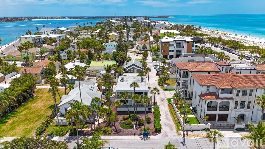 A beachfront community with a clear blue sky above.