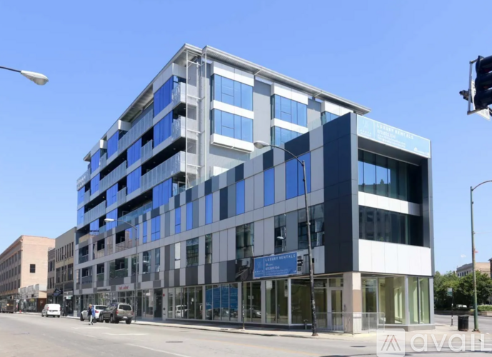 A modern multi-story building with a blue and white facade.
