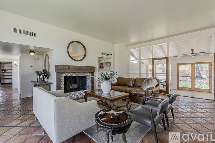 A living room with a fireplace and a couch.