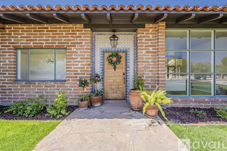 A house with a blue and white wreath on the door.