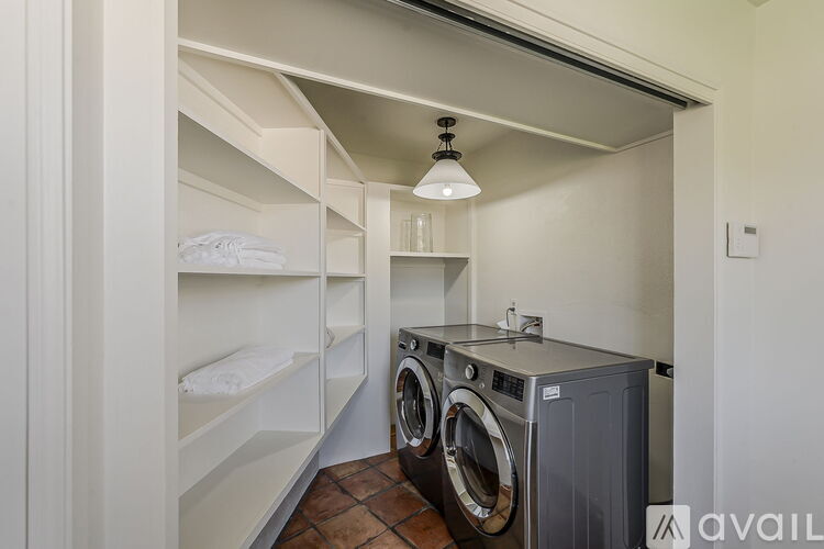 A laundry room with a washer and dryer.