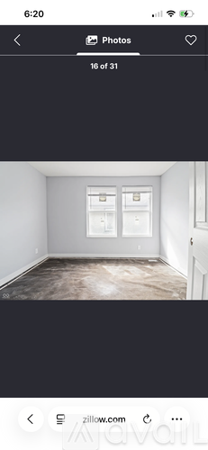 A room with a window and a door.